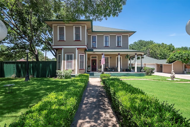 view of front of property featuring a porch and a front yard