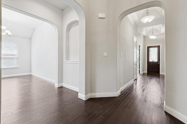 entrance foyer with a healthy amount of sunlight and dark hardwood / wood-style floors