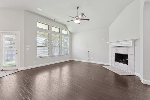 unfurnished living room featuring ceiling fan, high vaulted ceiling, dark hardwood / wood-style floors, and a fireplace