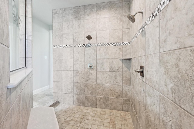 bathroom featuring a tile shower