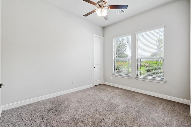 unfurnished room with ceiling fan and carpet floors