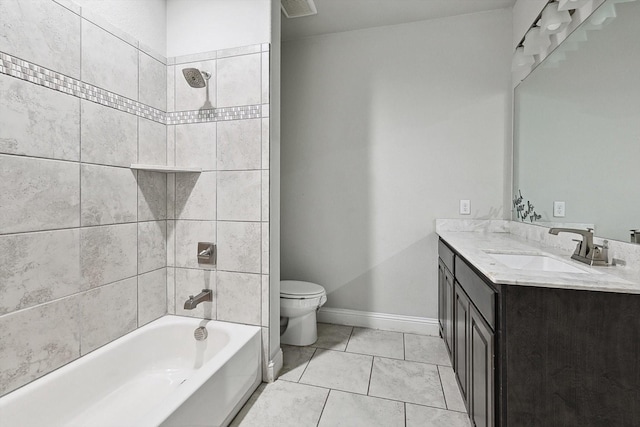 full bathroom featuring tiled shower / bath combo, vanity, tile patterned flooring, and toilet