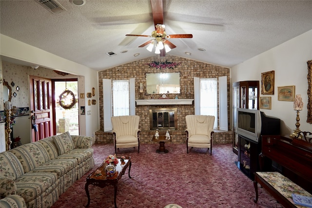 living room with a brick fireplace, brick wall, carpet, and ceiling fan