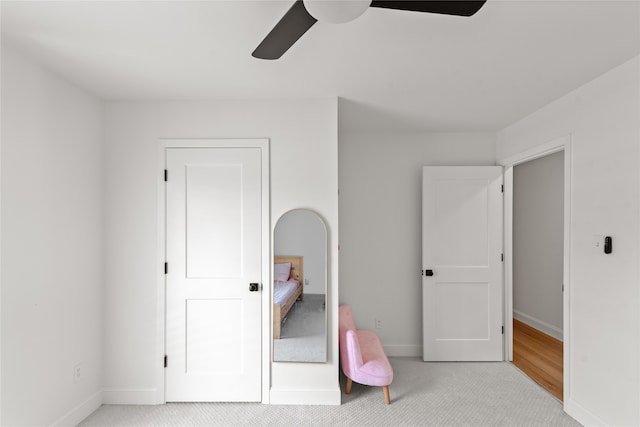 carpeted bedroom featuring ceiling fan