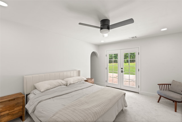 carpeted bedroom featuring access to outside, ceiling fan, and french doors