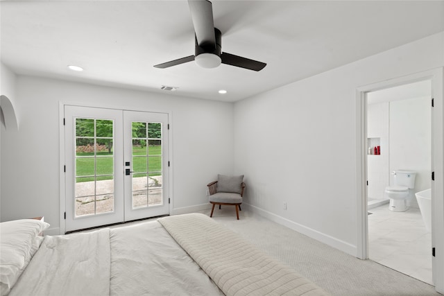 carpeted bedroom featuring ceiling fan, access to exterior, ensuite bathroom, and french doors