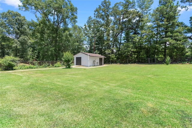 view of yard with a garage and an outdoor structure