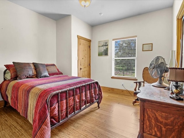 bedroom with hardwood / wood-style floors