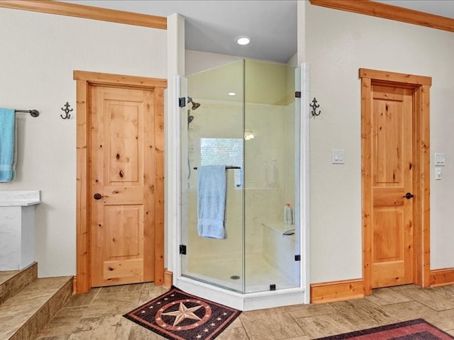 bathroom featuring tile floors and a shower with shower door