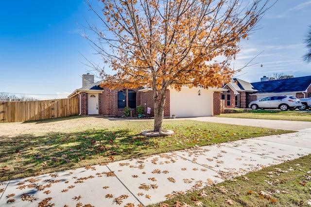 view of front facade with a front yard and a garage