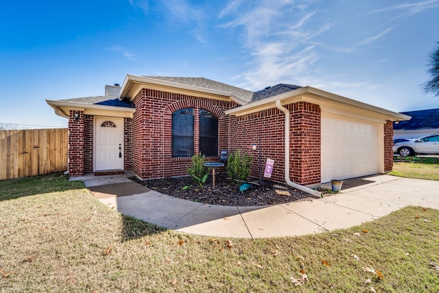 single story home with a garage and a front lawn