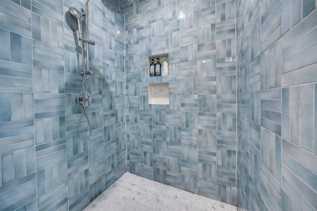 bathroom with a tile shower