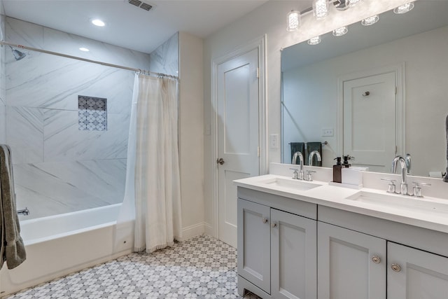 bathroom with shower / bath combo and vanity