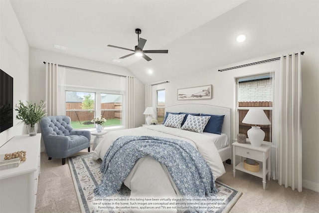 carpeted bedroom featuring vaulted ceiling and ceiling fan