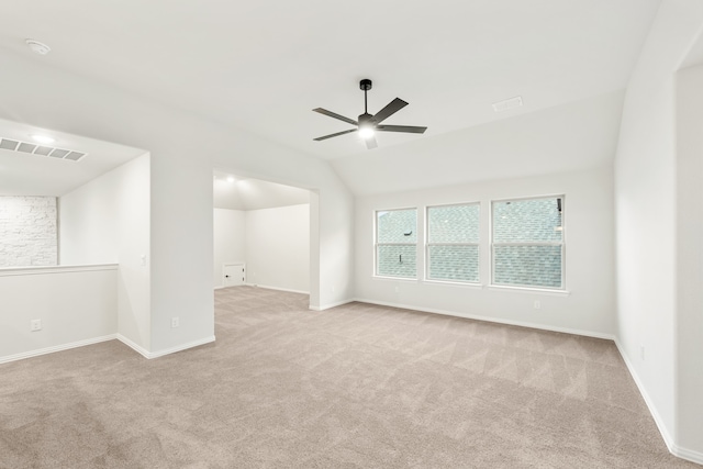 additional living space featuring lofted ceiling, ceiling fan, and light colored carpet