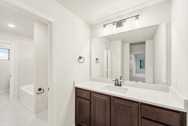 bathroom featuring tile patterned floors, tub / shower combination, and vanity