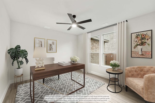 office area featuring ceiling fan and light wood-type flooring