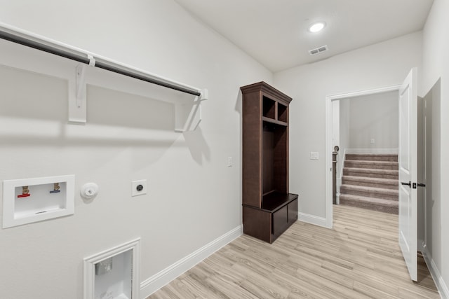 washroom featuring hookup for a washing machine, electric dryer hookup, gas dryer hookup, and light hardwood / wood-style flooring