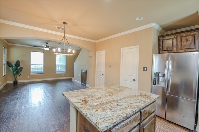 kitchen featuring stainless steel refrigerator with ice dispenser, wood-type flooring, ceiling fan, and a kitchen island