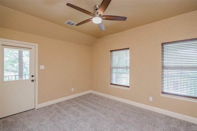 carpeted spare room with ceiling fan