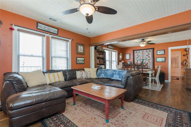 living room with ceiling fan and hardwood / wood-style flooring