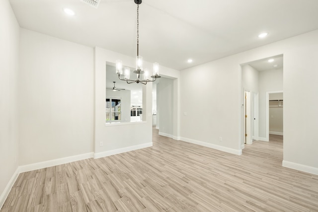 unfurnished dining area with ceiling fan and light hardwood / wood-style flooring