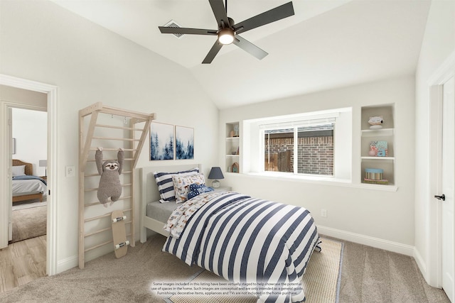 bedroom with light wood-type flooring, lofted ceiling, and ceiling fan