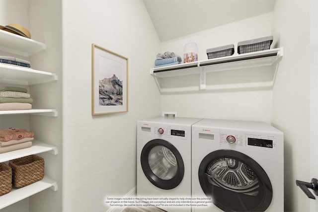 laundry room with washing machine and dryer