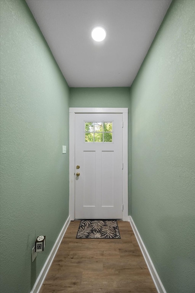 doorway with dark hardwood / wood-style floors