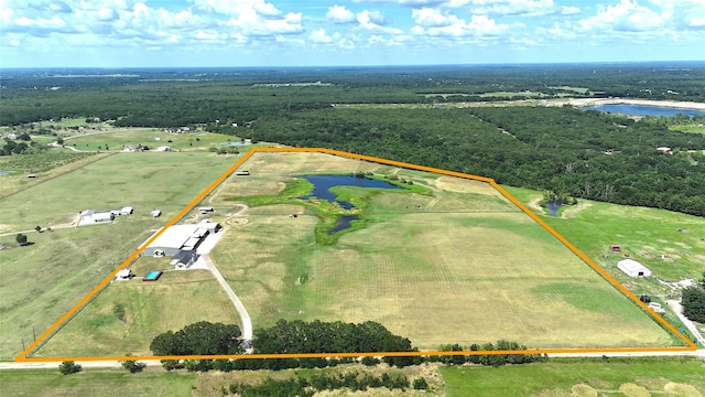 birds eye view of property featuring a rural view and a water view