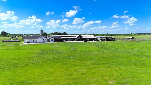 view of yard with a rural view