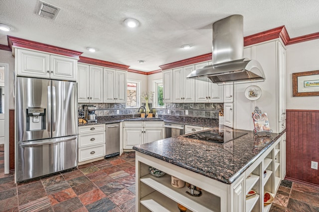 kitchen featuring island exhaust hood, stainless steel appliances, backsplash, and white cabinetry