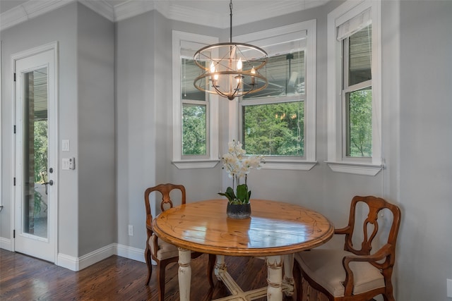 dining area featuring a notable chandelier, ornamental molding, and dark wood-type flooring