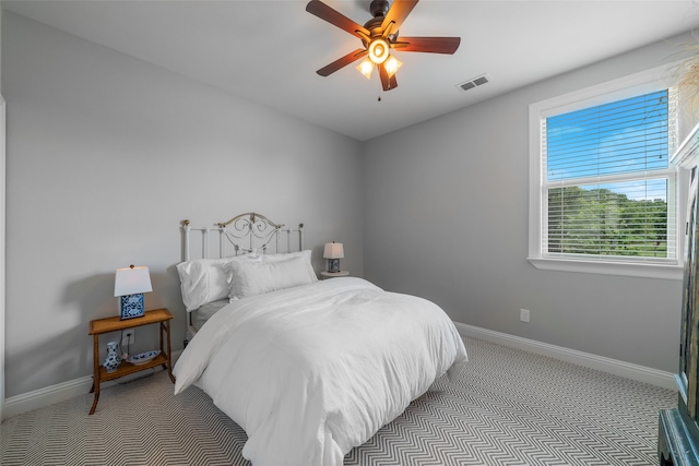 carpeted bedroom featuring ceiling fan