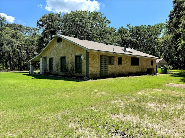 view of home's exterior featuring a lawn and central air condition unit