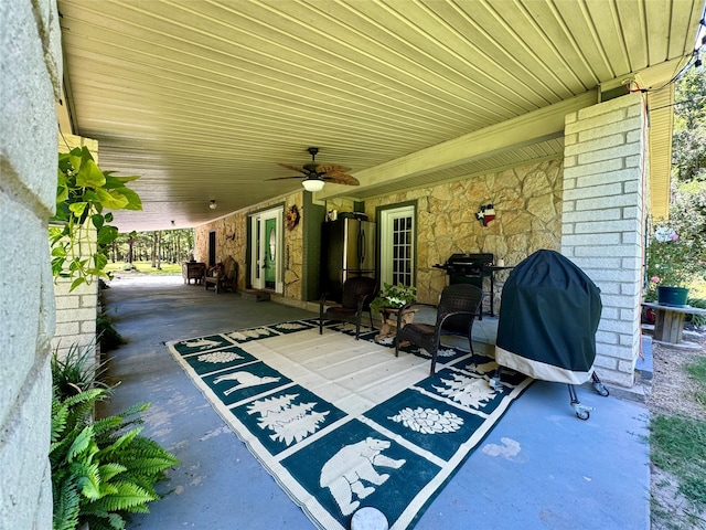 view of patio featuring ceiling fan