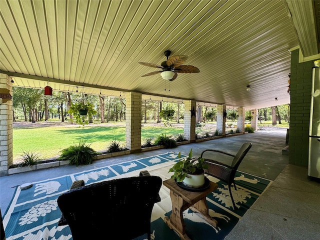 view of patio featuring ceiling fan