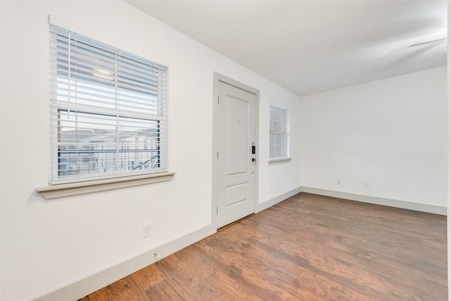 entrance foyer featuring wood finished floors and baseboards