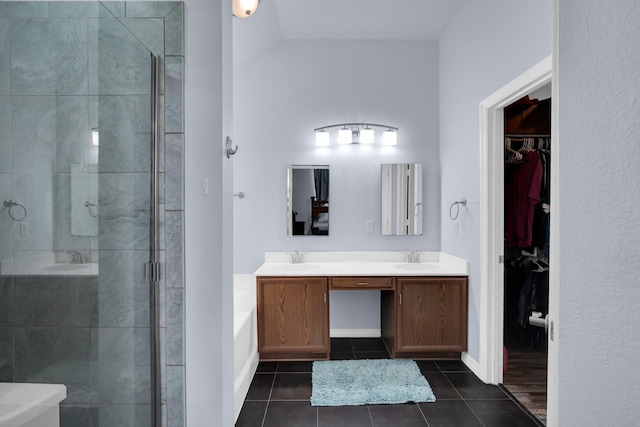 bathroom with vanity, tile patterned flooring, and a shower with door