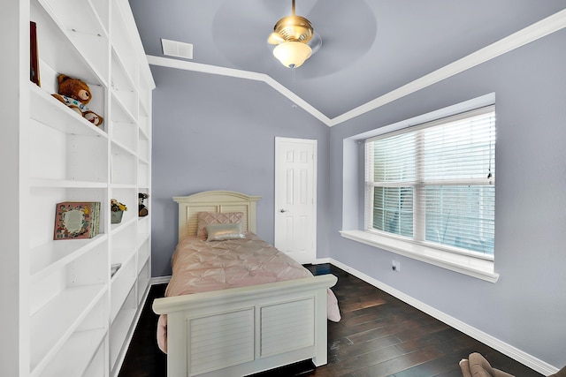 bedroom featuring ceiling fan, dark hardwood / wood-style flooring, lofted ceiling, and ornamental molding