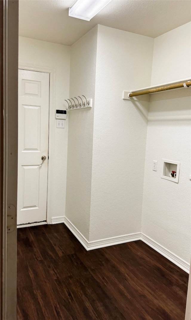 laundry room with dark hardwood / wood-style floors and hookup for a washing machine