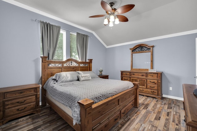 bedroom featuring ceiling fan, vaulted ceiling, dark wood-type flooring, and ornamental molding