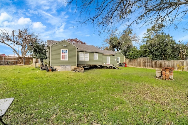 back of house with a lawn