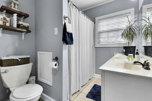 bathroom featuring tile patterned flooring, vanity, ornamental molding, and toilet