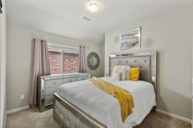 bedroom with lofted ceiling and light carpet