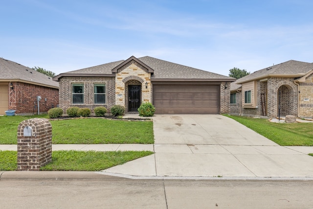 ranch-style home with a front yard and a garage