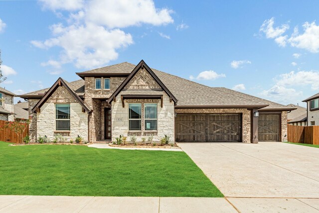 view of front facade featuring a front yard and a garage