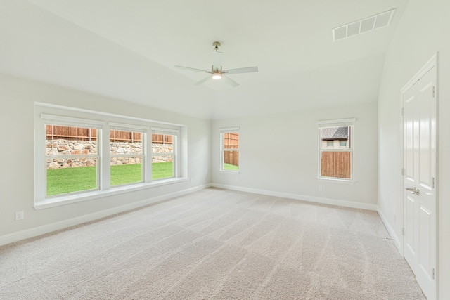 carpeted empty room featuring lofted ceiling and ceiling fan