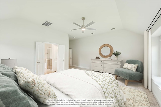 carpeted bedroom featuring lofted ceiling and ceiling fan