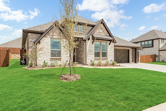 craftsman inspired home featuring a garage and a front yard